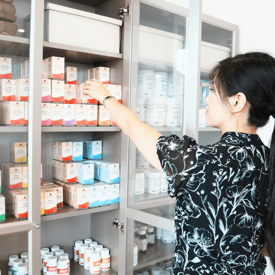 Woman receiving acupuncture therapy